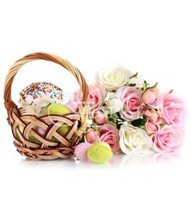 easter cake and eggs in a basket with flowers